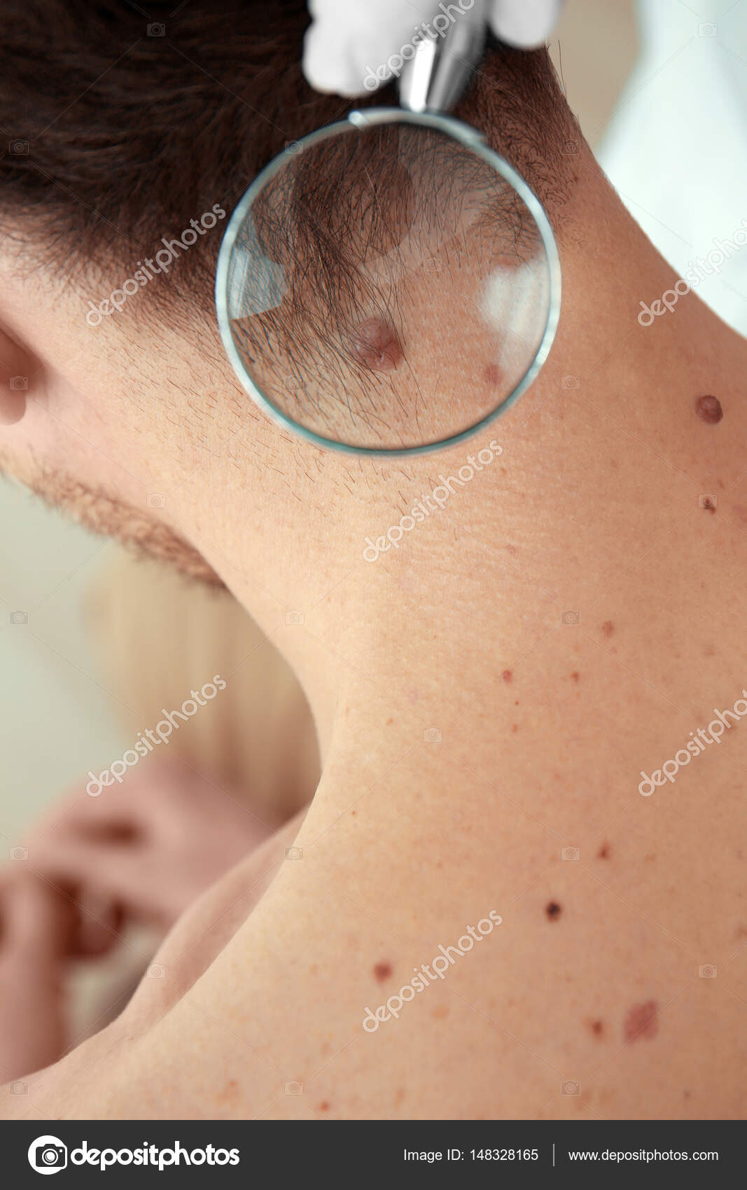 Man moisturising eyes